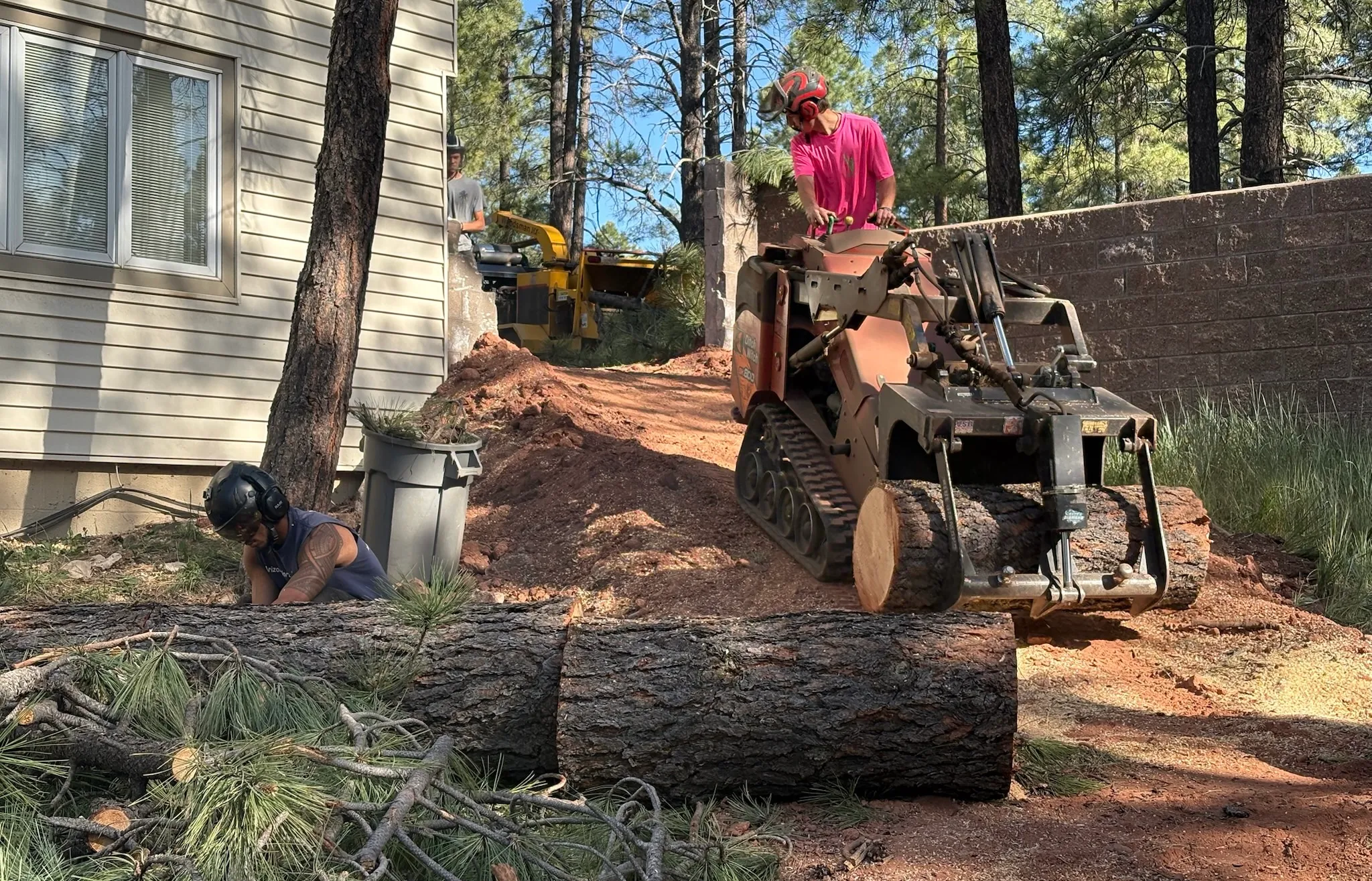 The crew clearing a job site